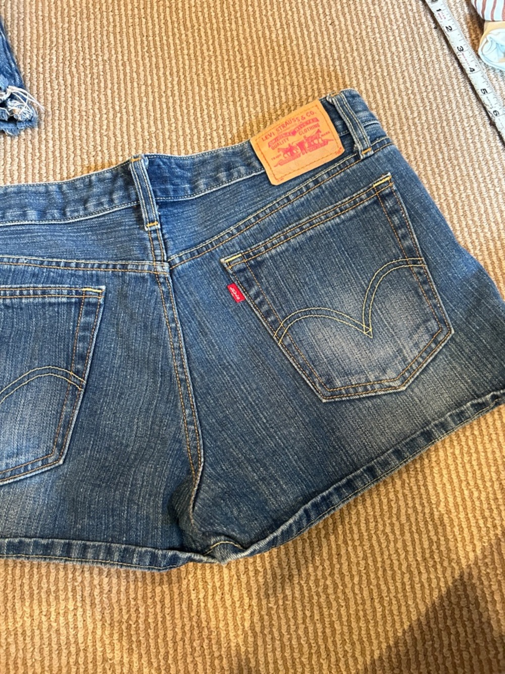 Levi's Women's Medium Blue Denim Cutoff Shorts with Signature Red Tab size 32
